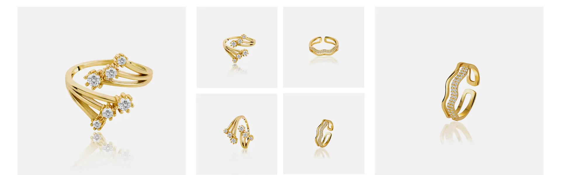 Collection of gold diamond rings photographed on a white background with reflections for a luxury jewelry catalog.